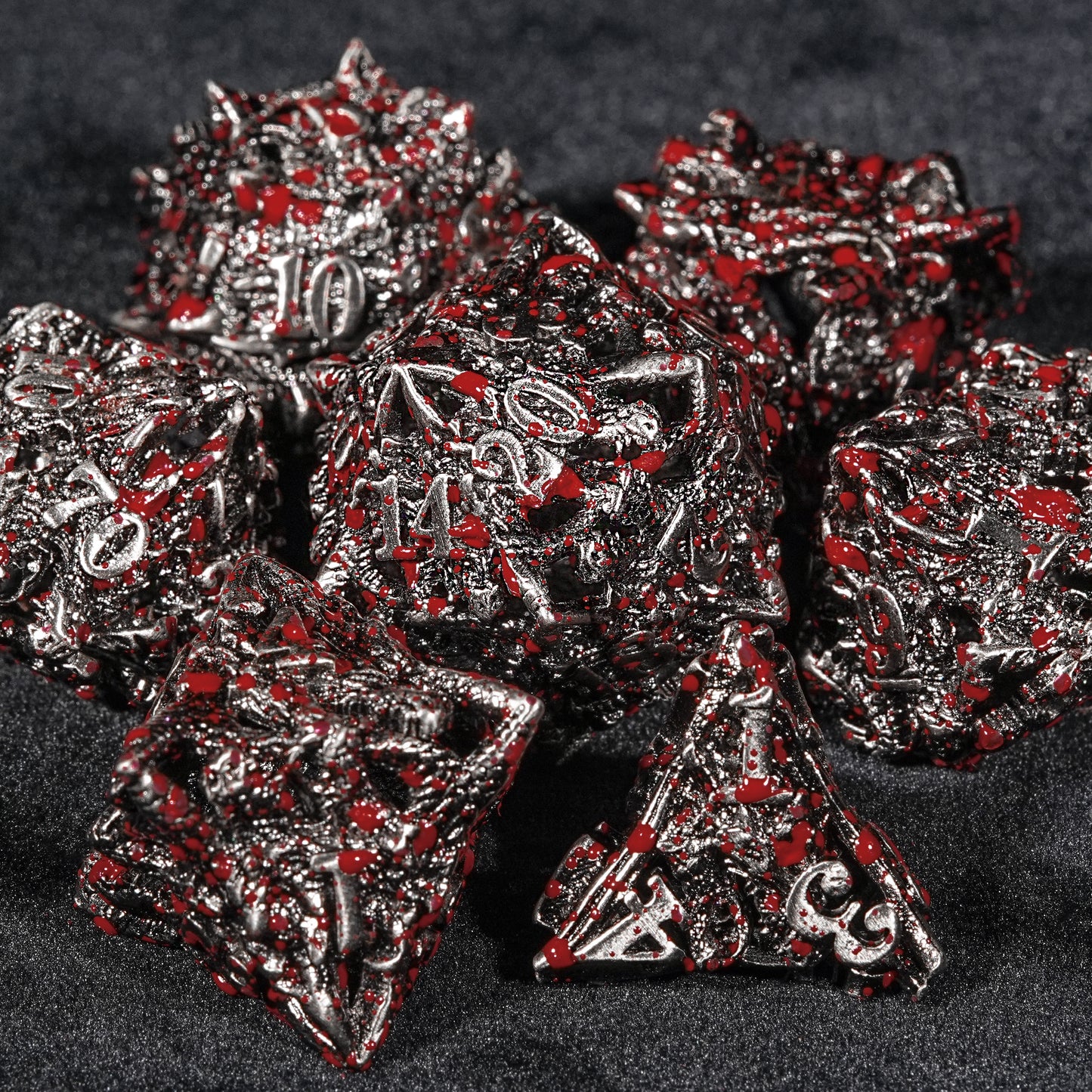 Blood-stained metal dragon head dice set.