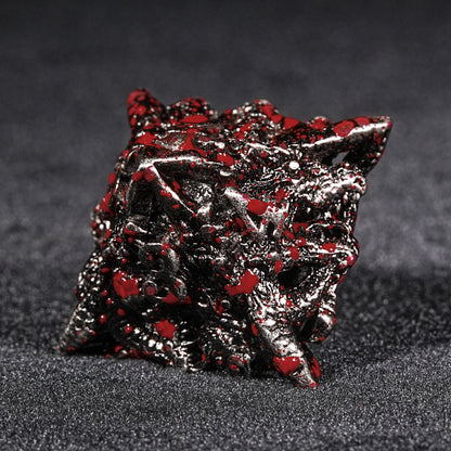 Blood-stained metal dragon head dice set.